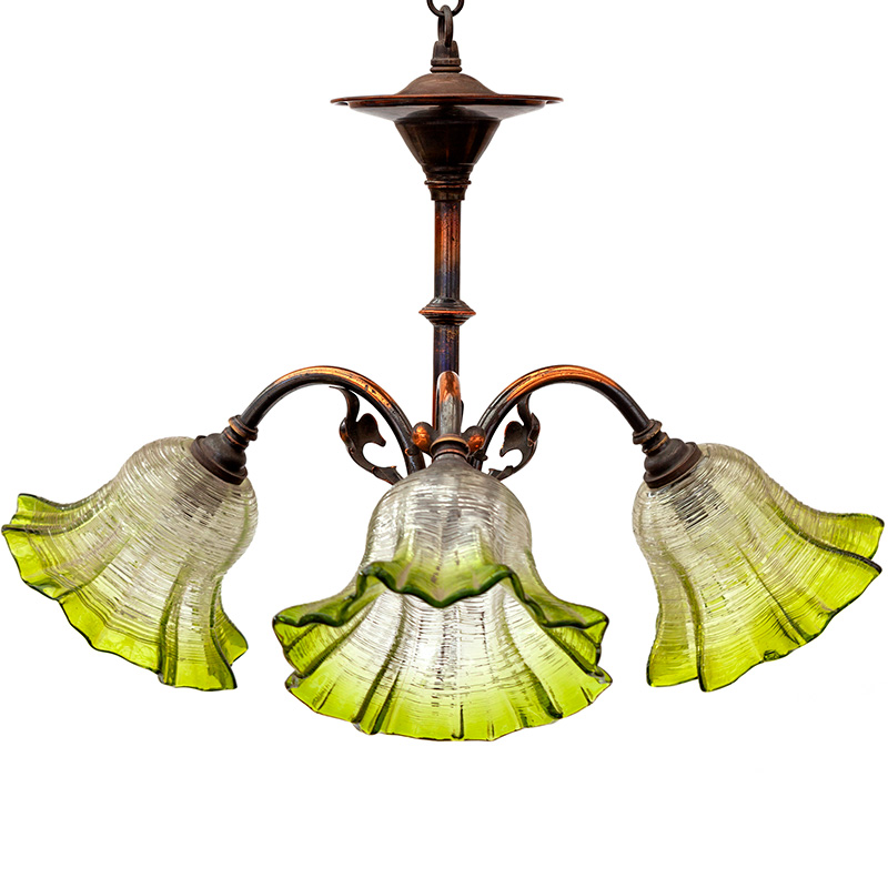 Art Nouveau copper oxidised brass three light chandelier of organic form fitted with gradating clear and green fluted glass shades. (c.1895).