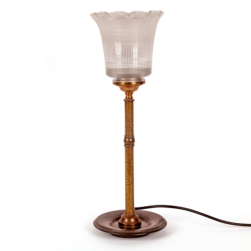Art Deco brass table lamp on a circular black marble base, textured column fitted with a fluted prismatic glass shade (c.1925)