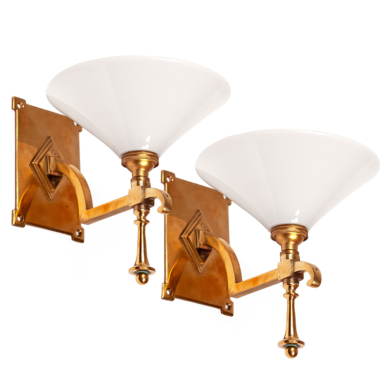 Pair of antique Odeon style cast brass wall lights fitted with opal conical glass shades (c.1925).